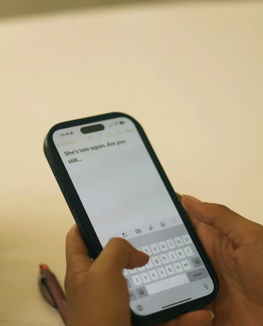 Hands typing a reply on a smartphone
