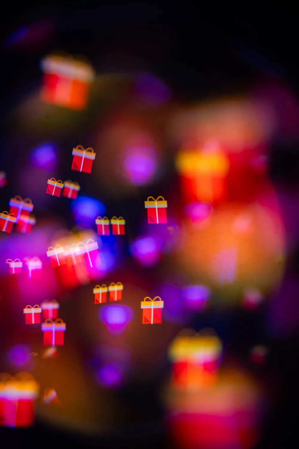 Glowing gift box icons floating over a colorful bokeh background